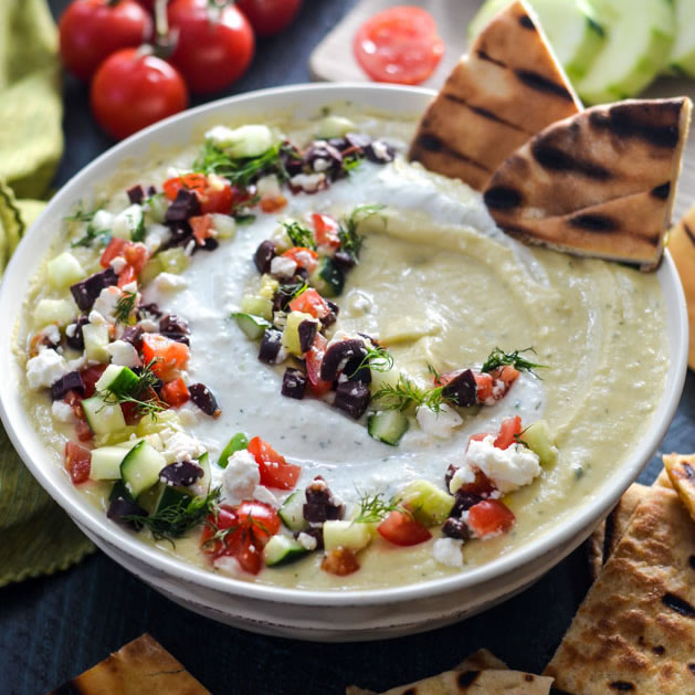 Three dips and pitta bread slices Meltemi Catering